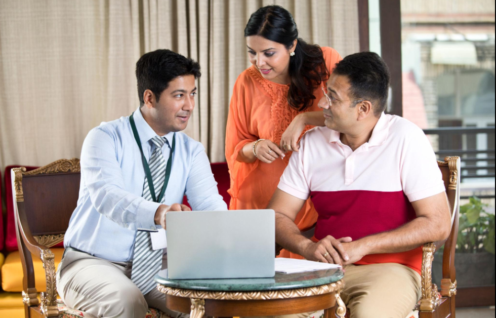 Financial consultation session at Victory Investment Solutions financial consultancy office in West Patel Nagar New Delhi showing advisor discussing LIC policy options with client